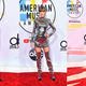 Illustration for article titled Statement Suits, Plush Pinks, and a Lotta Gowns on the American Music Awards Red Carpet
